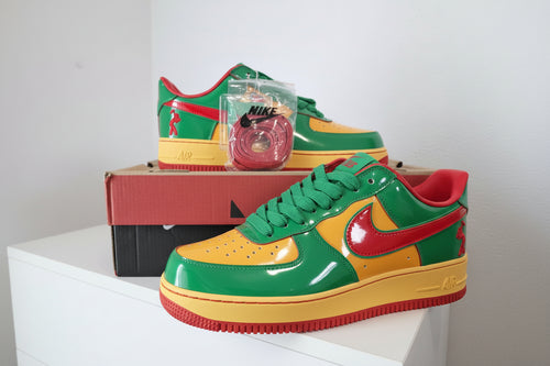 Colorful sneakers with a red swoosh logo on a white background